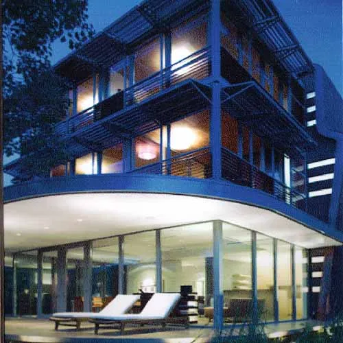 Patio View With Glazed & Louvered Bedroom Wing Above